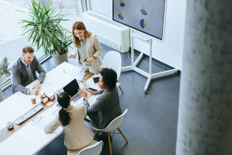 Team of Legal Experts discussing plans at a table with clients