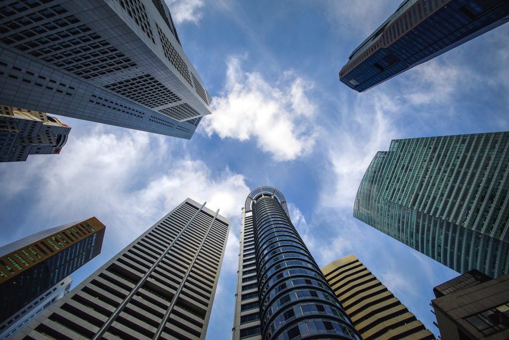 A view of the sky between skyscrapers.