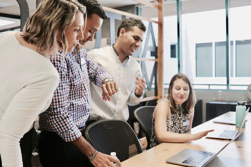 Professionals discussing work in an office.